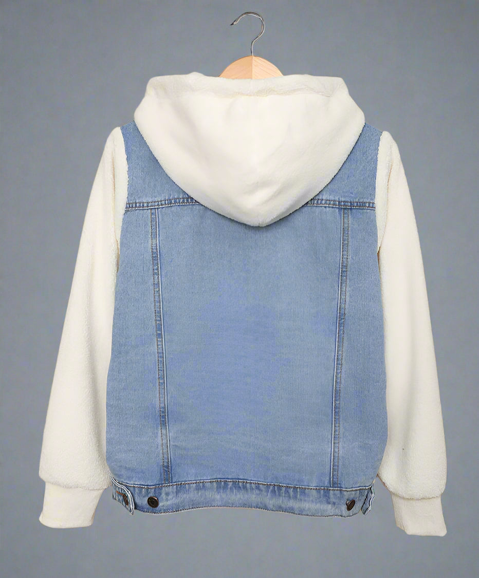 Denim jacket with white hoodie on a beige background