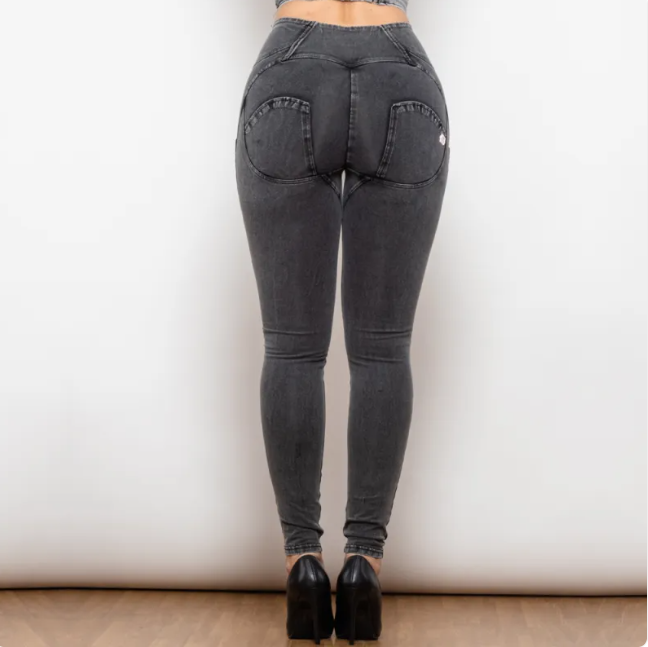 Black jeans worn by a person on a plain background