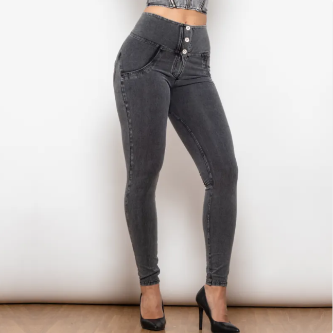 Black jeans worn by a person on a plain background