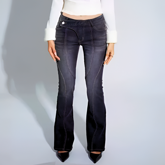 Black flared jeans worn by a person on a light gray background
