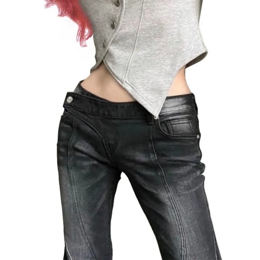 Person wearing black leather pants and a gray jacket on a white background