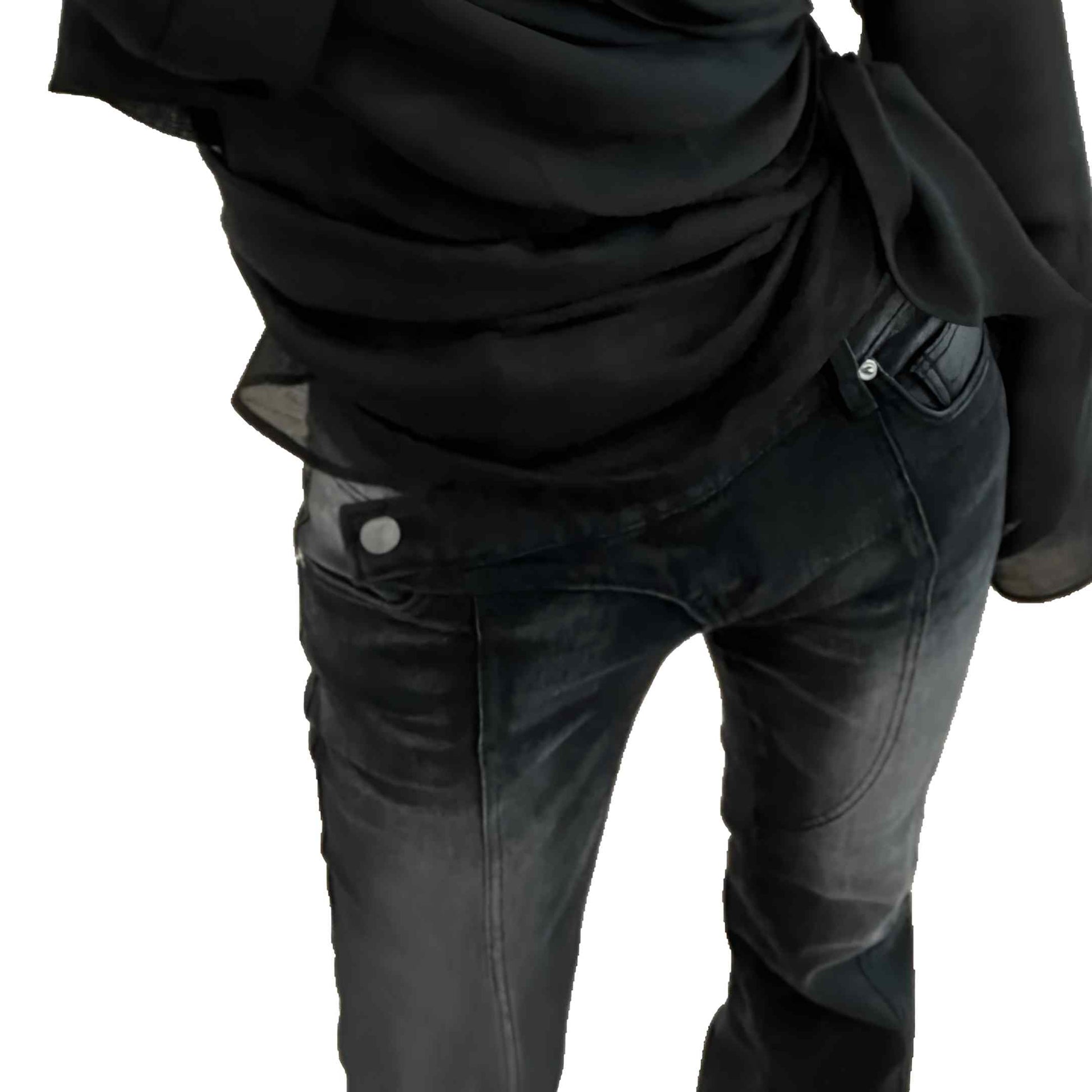 Person wearing a black shirt and dark jeans on a white background