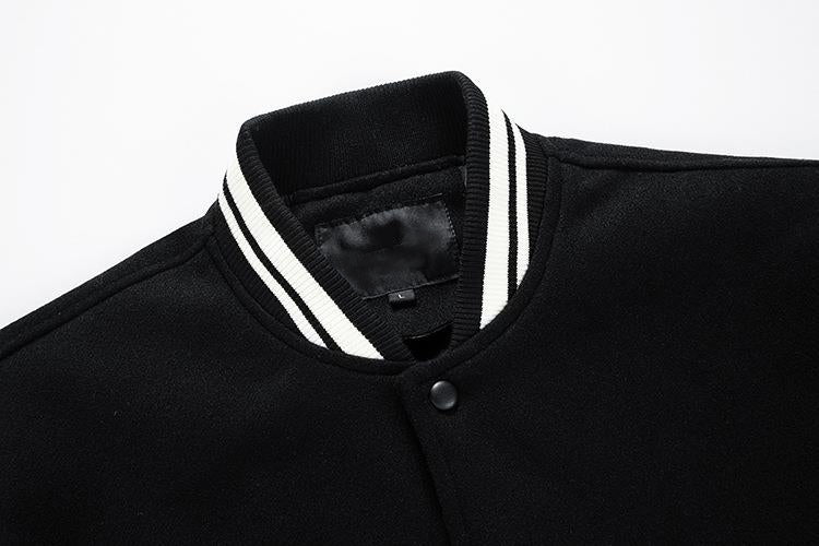 Black jacket with white trim on a white background