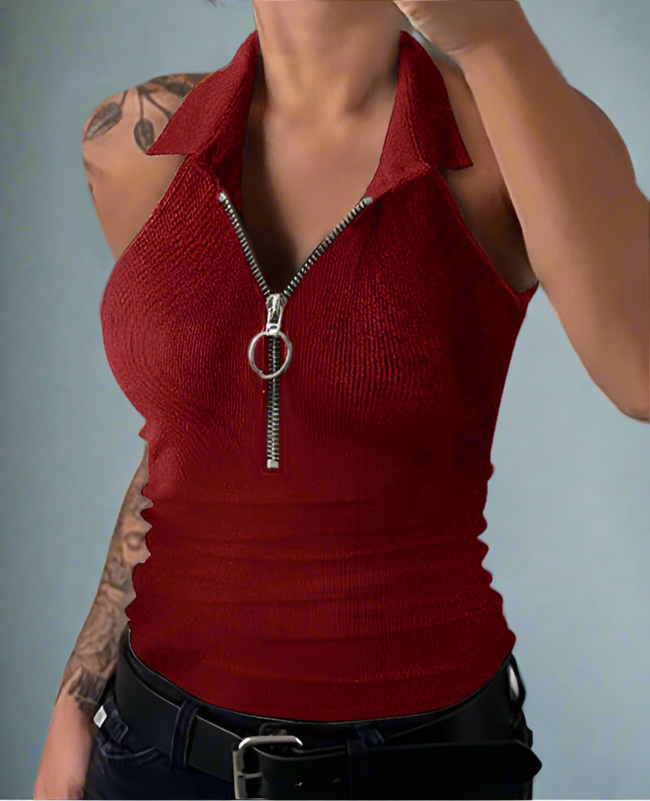 Red sleeveless top with a zipper detail on a plain background