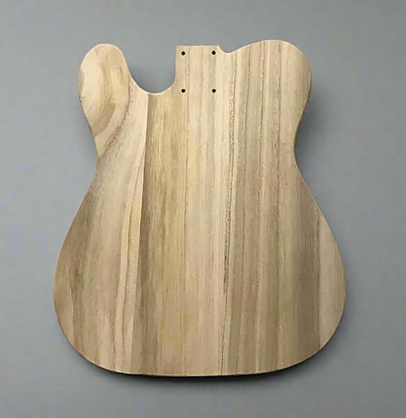 Wooden guitar body on a gray background