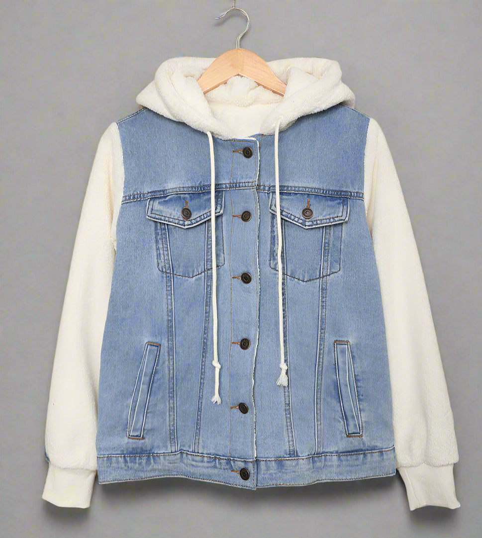 Denim jacket with white hoodie on a beige background