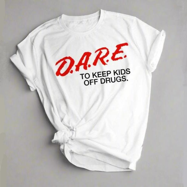 White t-shirt with 'D.A.R.E. To Keep Kids Off Drugs' text on a gray background