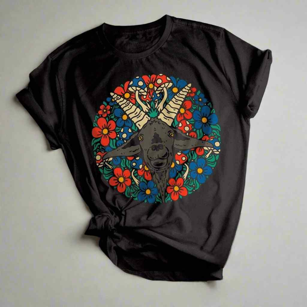 Black t-shirt with a colorful goat skull and floral design on a light gray background
