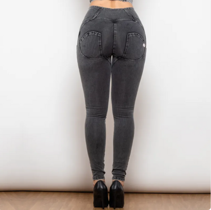 Black jeans worn by a person on a plain background