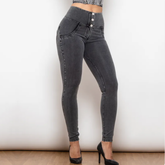 Black jeans worn by a person on a plain background