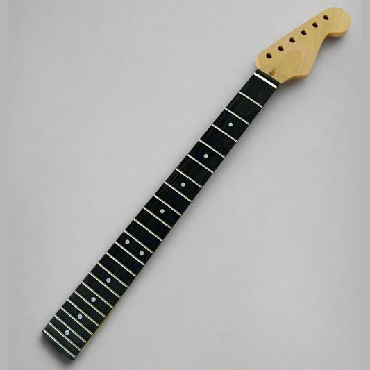 Guitar neck with black fretboard and white dot inlays on a gray background