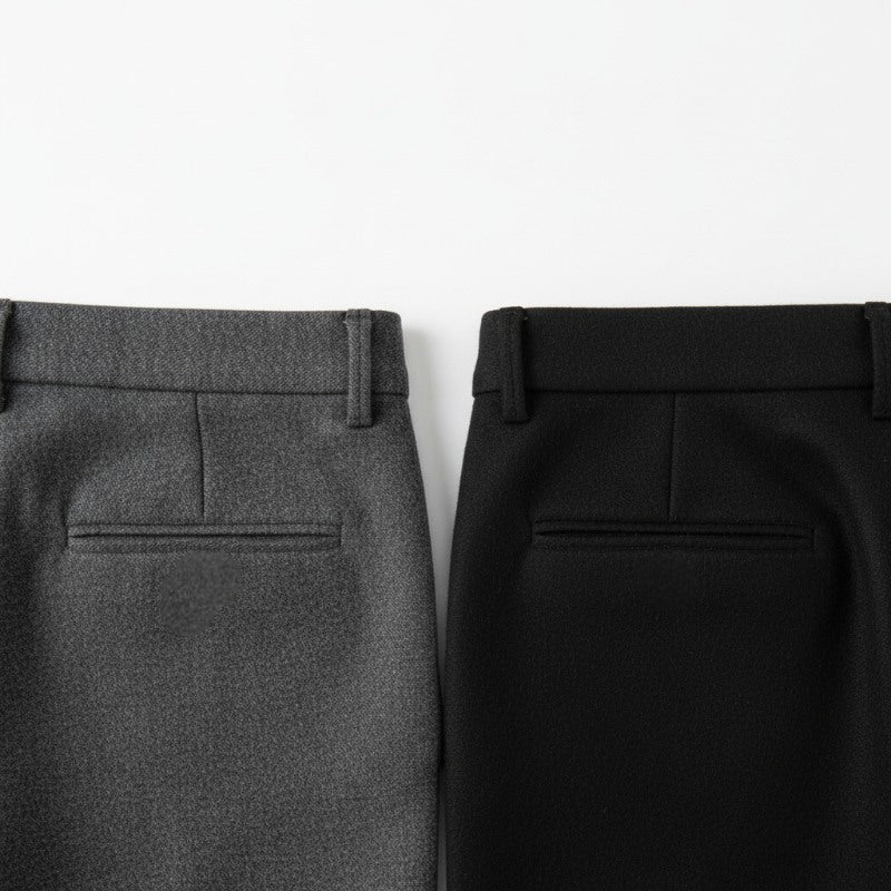 Close-up of gray and black pants on a white background