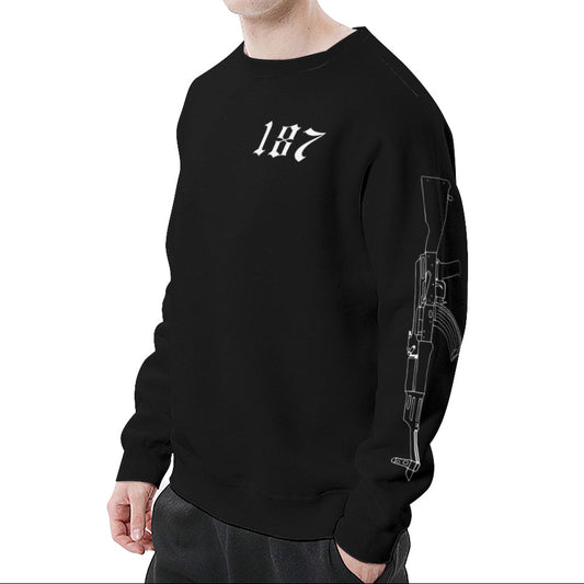 Man wearing a black sweatshirt with a design on the sleeve against a white background