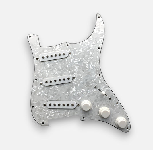Guitar pickguard with a speckled white and gray design on a white background
