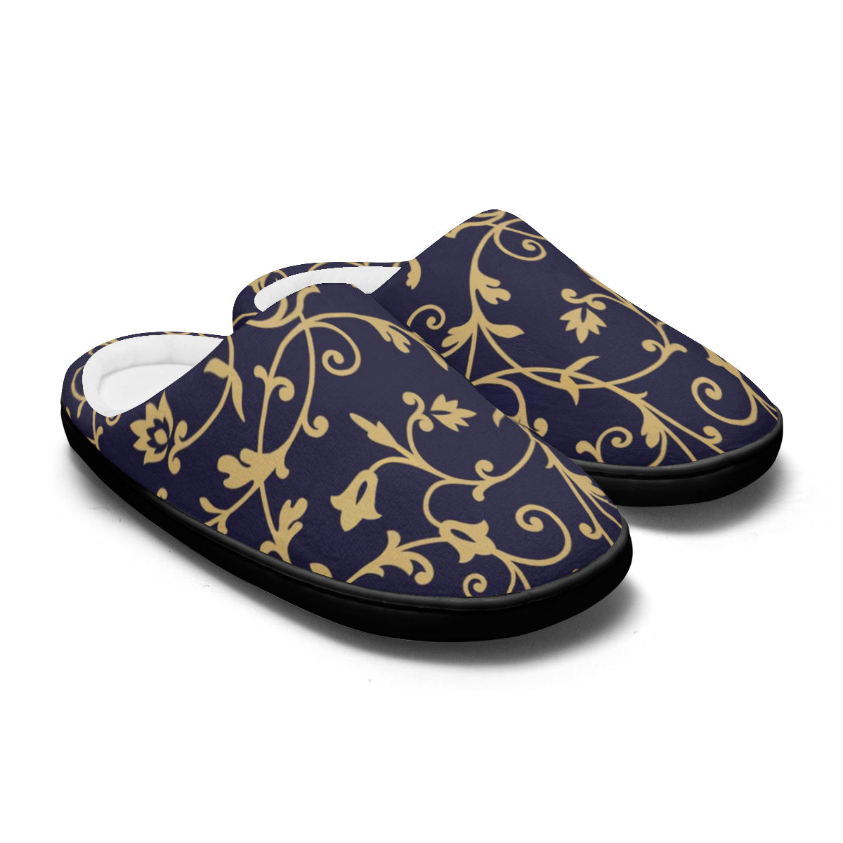 Pair of black slippers with gold floral patterns on a white background