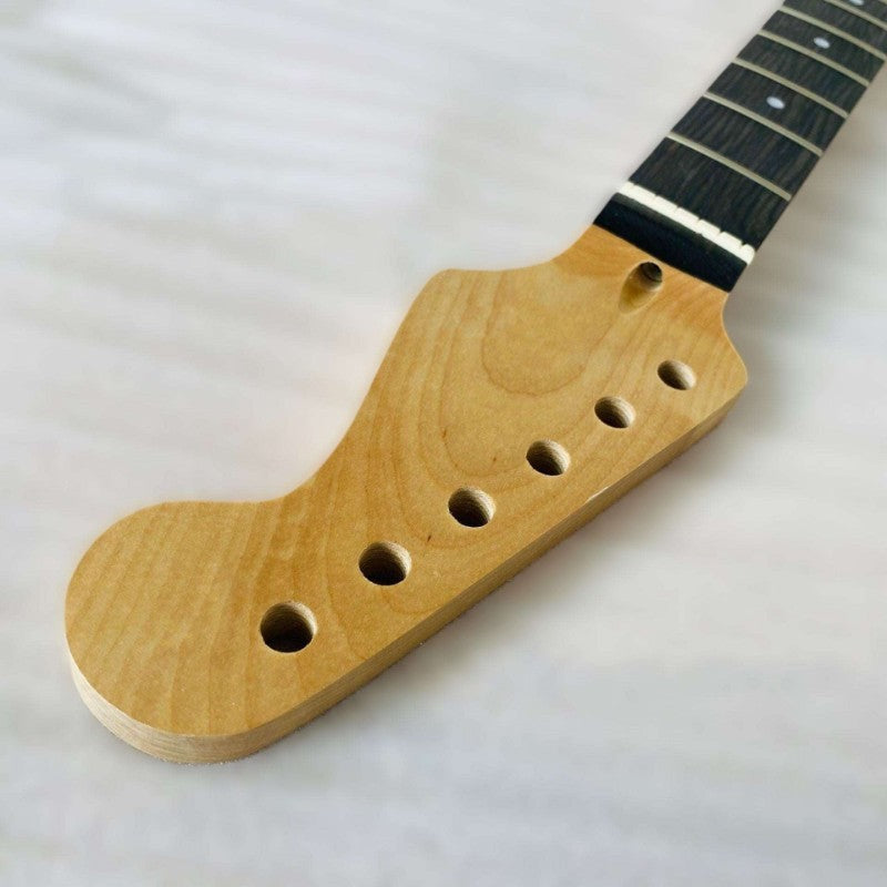 Wooden guitar neck with black fretboard on a white background