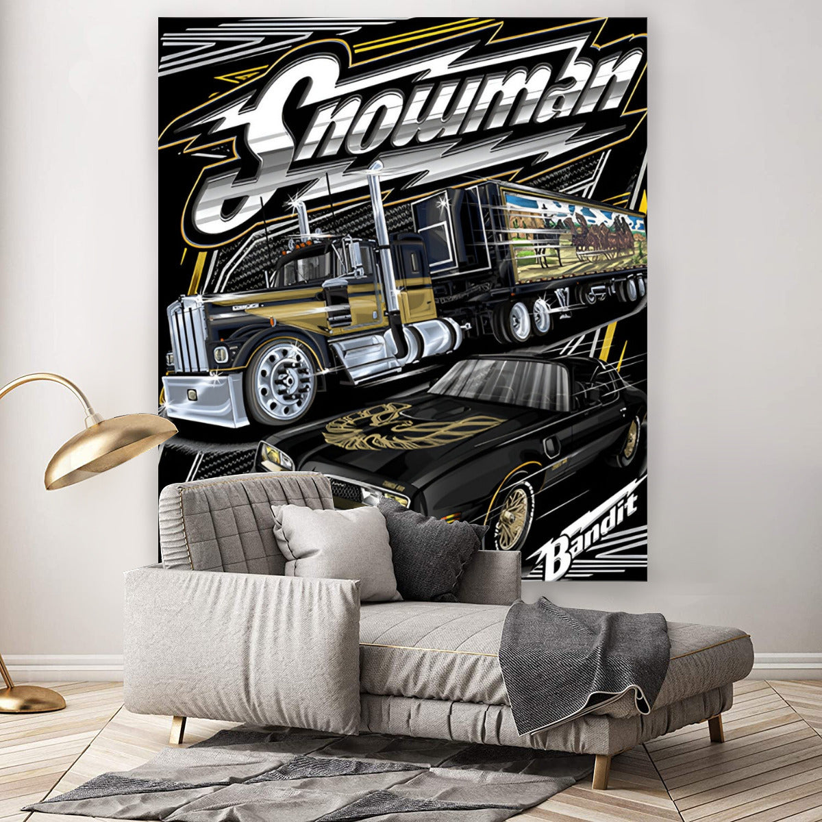 Decorative wall tapestry with a large truck design on a wall above a sofa.
