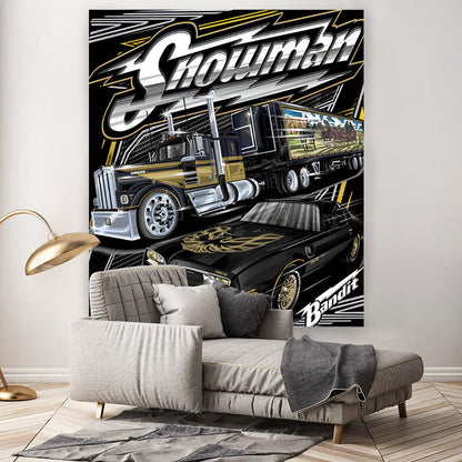 Decorative wall tapestry with a large truck design on a wall above a sofa.
