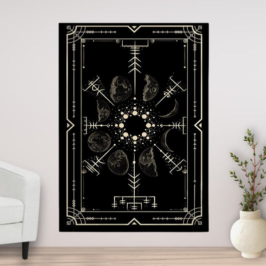 Decorative tapestry with geometric and celestial design on a wall in a room with a white armchair and plant.