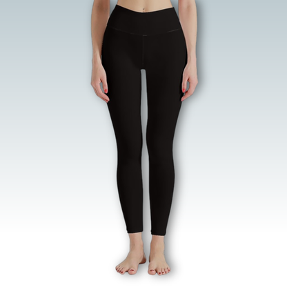 Person wearing black leggings on a light gray background