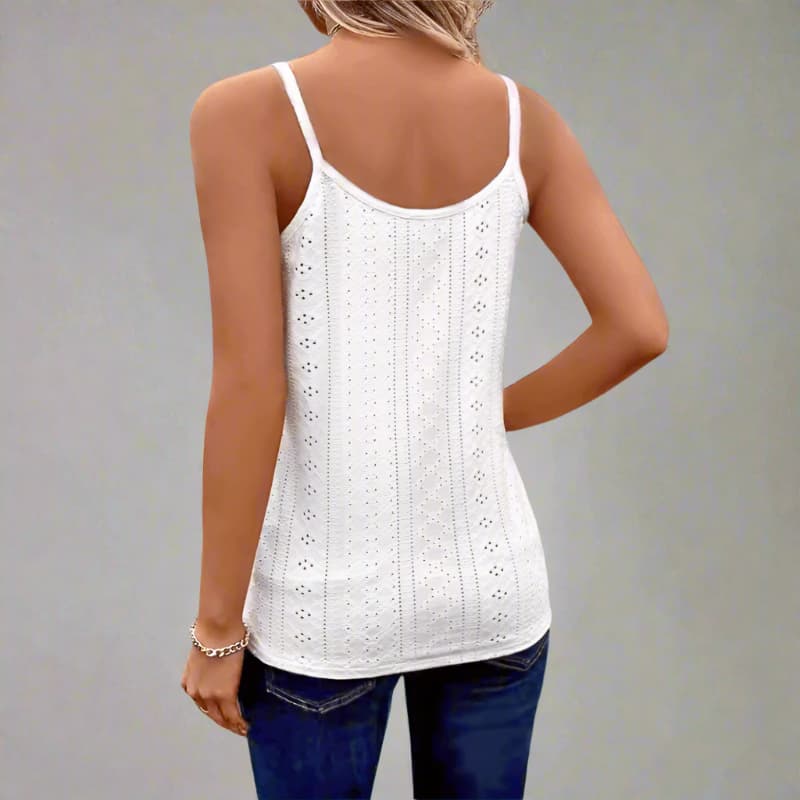 White lace tank top worn by a person on a plain background