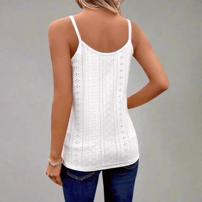 White lace tank top worn by a person on a plain background
