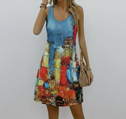 Woman wearing a colorful dress with abstract patterns against a plain background