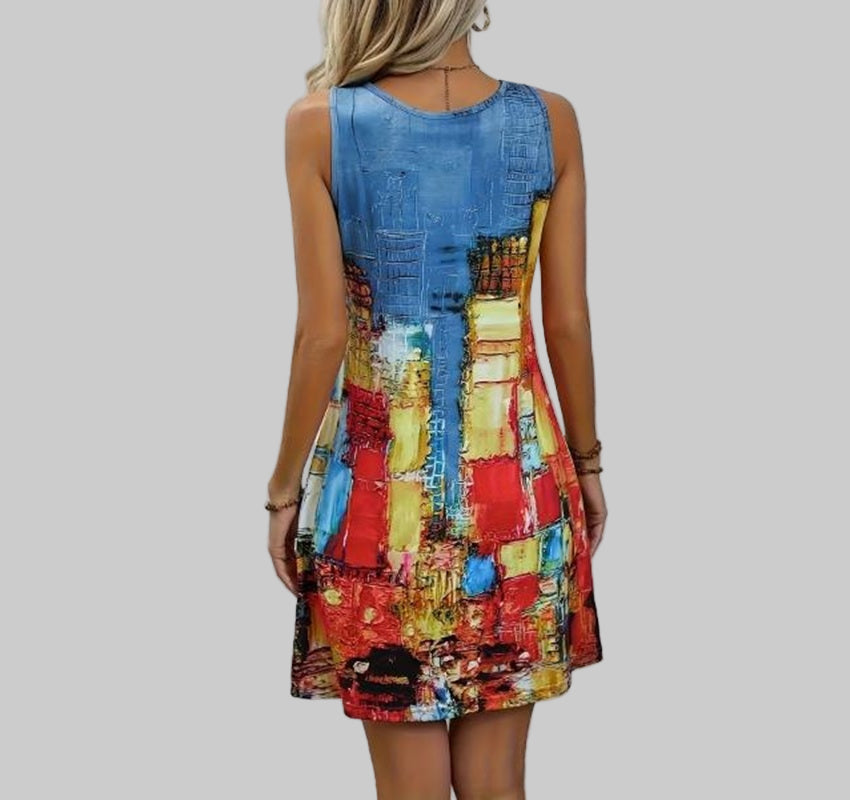 Woman wearing a colorful dress with abstract pattern against a plain background